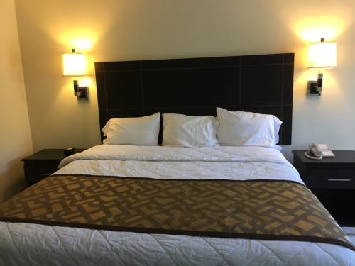 Imagen de la habitación del Hotel Curtis Inn & Suites. Foto 13