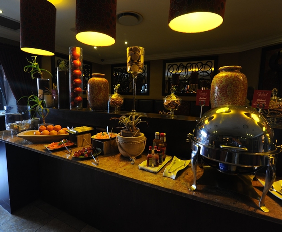 Imagen del bar/restaurante del Hotel Cycad Guest House. Foto 6