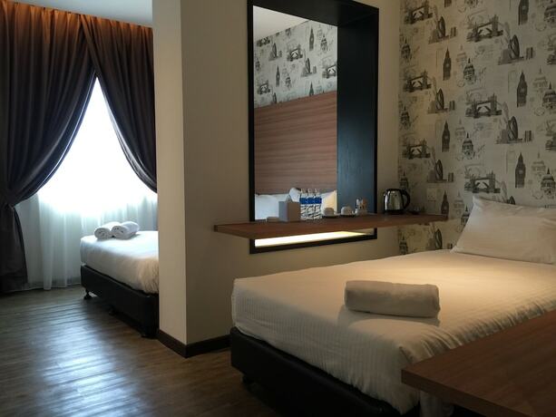 Imagen de la habitación del Hotel D Elegance. Foto 11