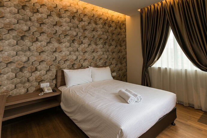 Imagen de la habitación del Hotel D Elegance. Foto 28