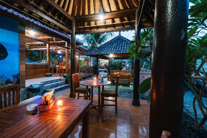 Imagen del bar/restaurante del Hotel D and B Bungalow's By Dewizz Management. Foto 3