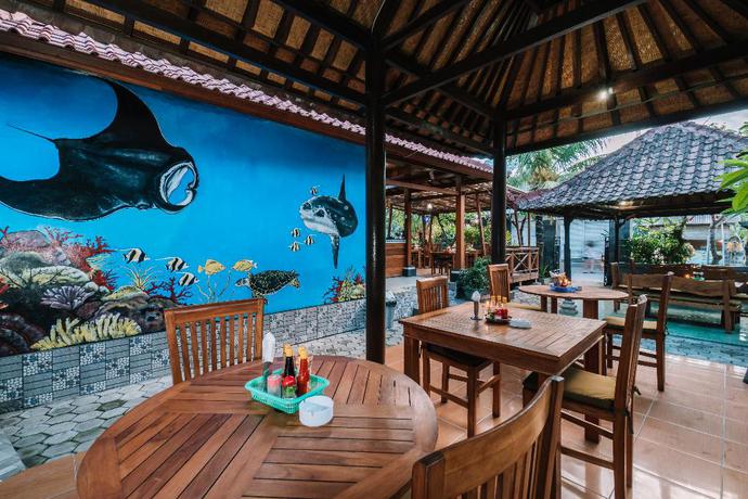 Imagen del bar/restaurante del Hotel D and B Bungalow's By Dewizz Management. Foto 5