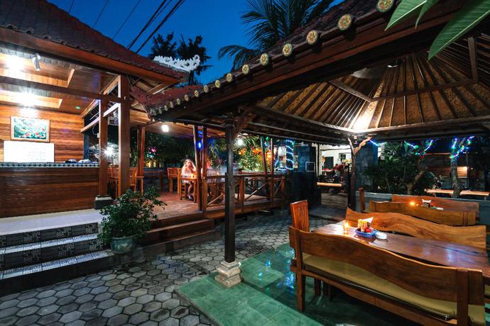 Imagen del bar/restaurante del Hotel D and B Bungalow's By Dewizz Management. Foto 8