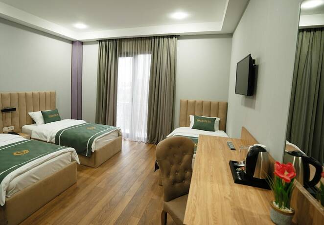 Imagen de la habitación del Hotel DADIANI Inn. Foto 12