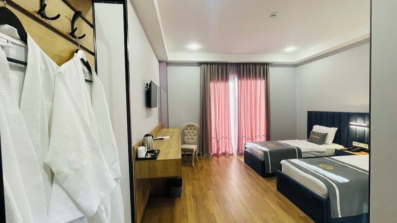 Imagen de la habitación del Hotel DADIANI Inn. Foto 13