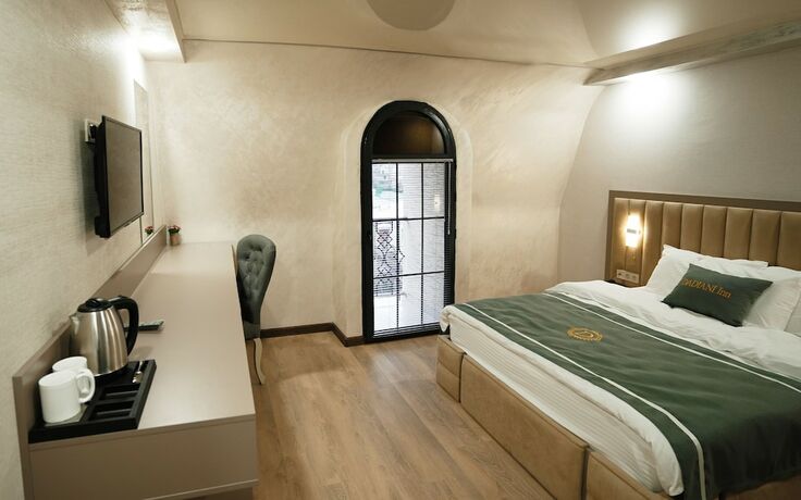 Imagen de la habitación del Hotel DADIANI Inn. Foto 14