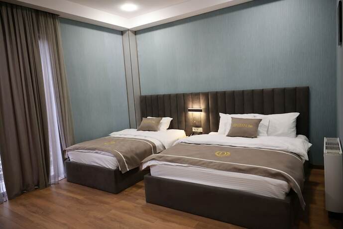 Imagen de la habitación del Hotel DADIANI Inn. Foto 17