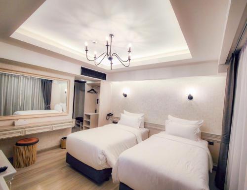 Imagen de la habitación del Hotel DAMNERNPAWA. Foto 13
