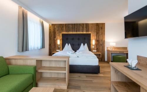 Imagen de la habitación del Hotel DAS ROYAL in Obereggen. Foto 20