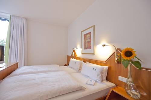 Imagen de la habitación del Hotel DAS SCHLOSSBERG - Boutique im Park- Nahe der Therme. Foto 4