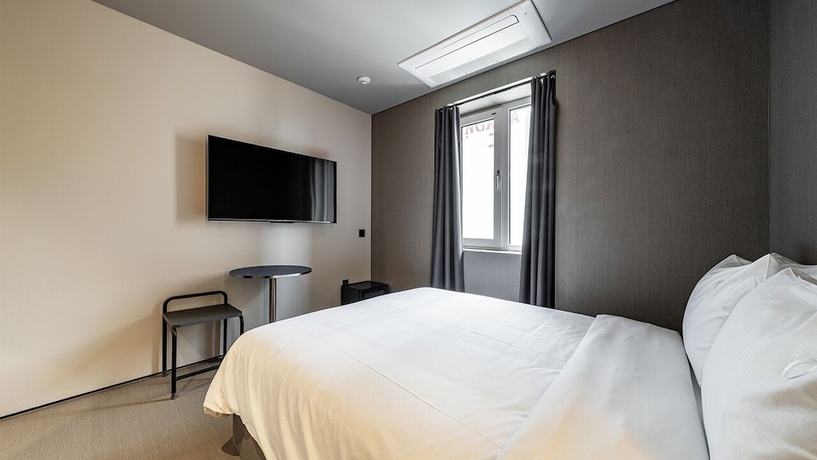 Imagen de la habitación del Hotel DAYONESTAY. Foto 7