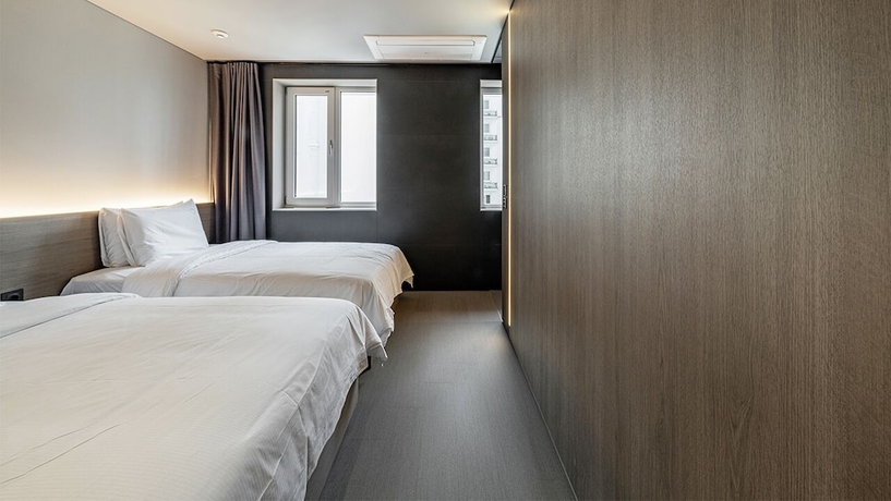 Imagen de la habitación del Hotel DAYONESTAY. Foto 10