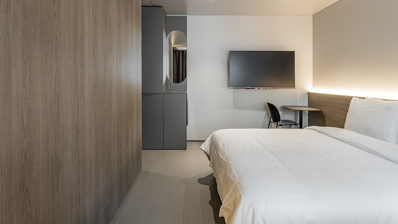 Imagen de la habitación del Hotel DAYONESTAY. Foto 13