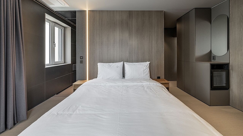 Imagen de la habitación del Hotel DAYONESTAY. Foto 15