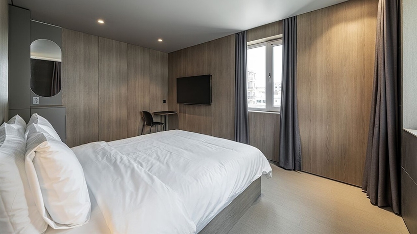 Imagen de la habitación del Hotel DAYONESTAY. Foto 18