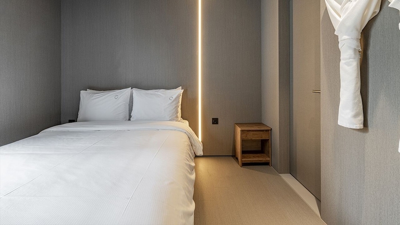 Imagen de la habitación del Hotel DAYONESTAY. Foto 19