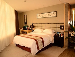 Imagen de la habitación del Hotel DAYS INN JINJIANG INTERNATIONAL. Foto 2