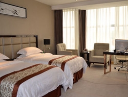 Imagen de la habitación del Hotel DAYS INN JINJIANG INTERNATIONAL. Foto 3
