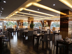 Imagen del bar/restaurante del Hotel DAYS INN JINJIANG INTERNATIONAL. Foto 1