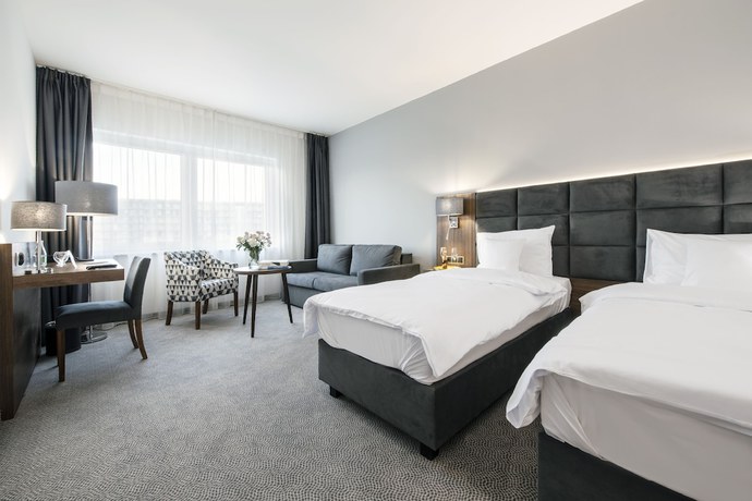 Imagen de la habitación del Hotel DB Hotel Wrocław. Foto 2