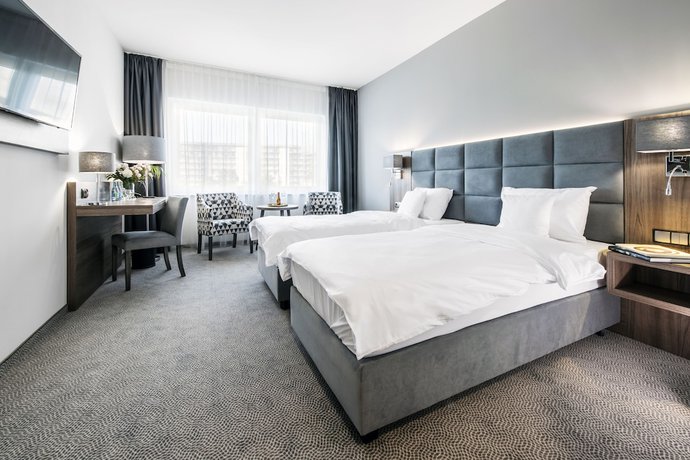 Imagen de la habitación del Hotel DB Hotel Wrocław. Foto 17