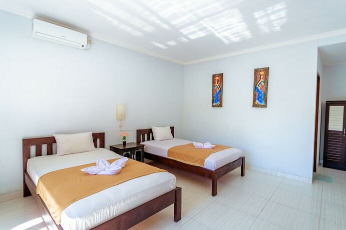 Imagen de la habitación del Hotel D\'Canggu Homestay. Foto 17