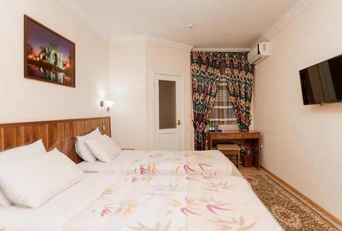 Imagen de la habitación del Hotel DILSHODA. Foto 7