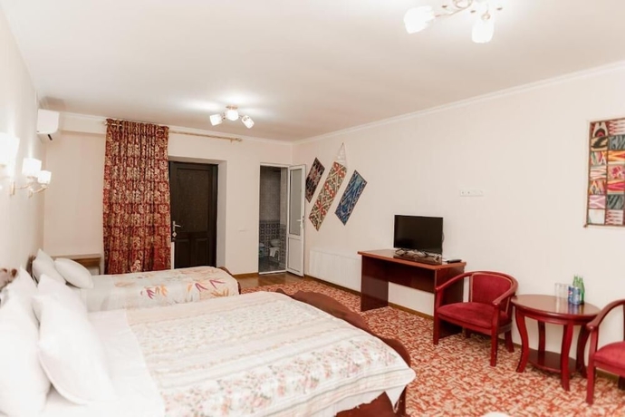 Imagen de la habitación del Hotel DILSHODA. Foto 9
