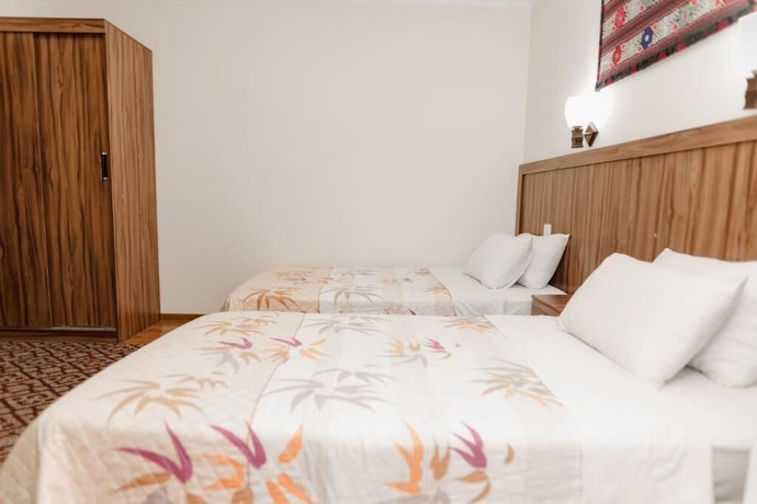 Imagen de la habitación del Hotel DILSHODA. Foto 13