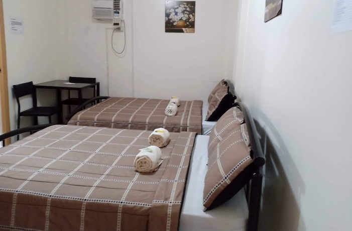 Imagen de la habitación del Hotel DMC Caralos Vacation Inn and Dormitory. Foto 10
