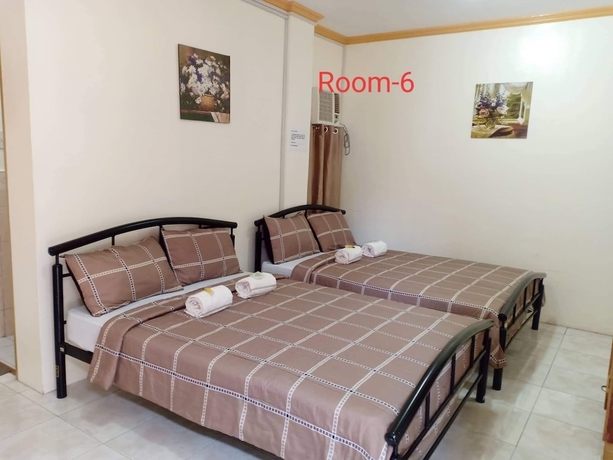 Imagen de la habitación del Hotel DMC Caralos Vacation Inn and Dormitory. Foto 11