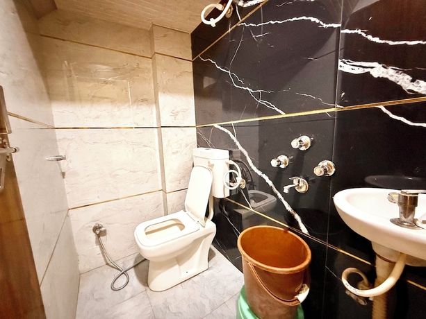 Imagen de la habitación del Hotel DMD Inn near Temple and Rail Staion. Foto 11