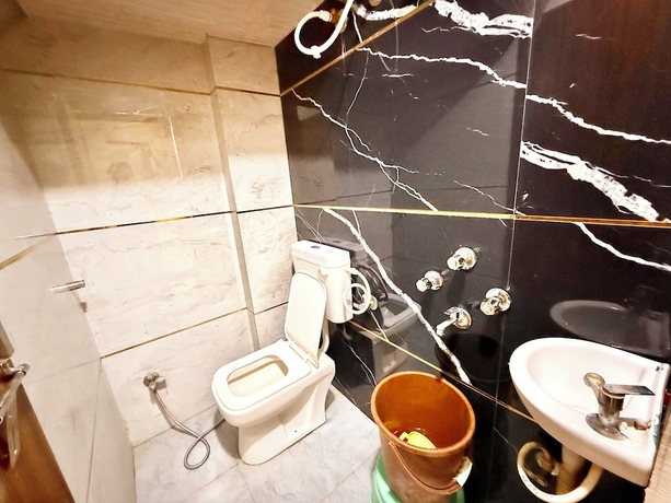 Imagen de la habitación del Hotel DMD Inn near Temple and Rail Staion. Foto 12