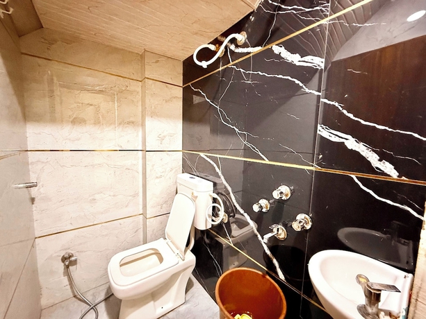 Imagen de la habitación del Hotel DMD Inn near Temple and Rail Staion. Foto 13