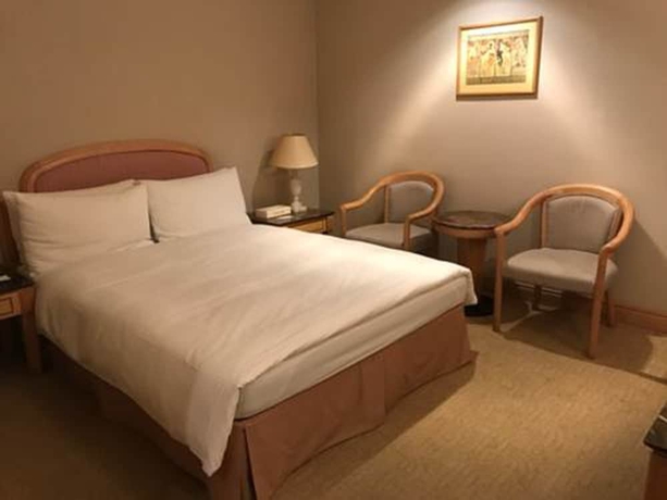 Imagen de la habitación del Hotel DONG WU HOTEL. Foto 9