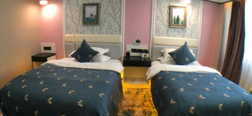 Imagen de la habitación del Hotel DONGBAO HOTEL. Foto 6