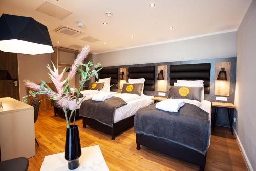 Imagen de la habitación del Hotel DORMERO Bremen. Foto 17