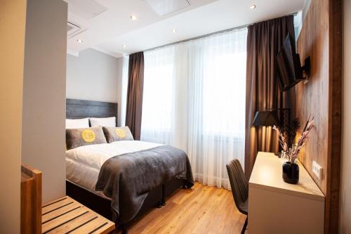 Imagen de la habitación del Hotel DORMERO Bremen. Foto 19