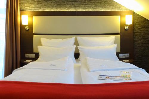 Imagen de la habitación del Hotel DORMERO Werther. Foto 3