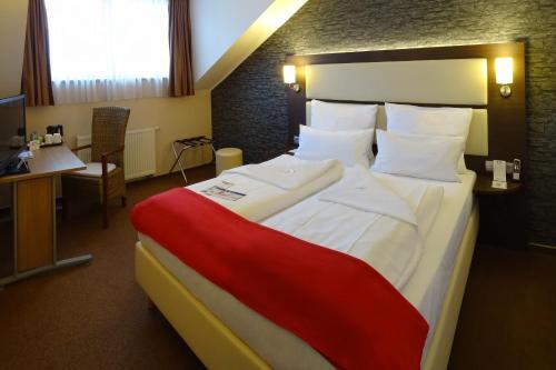 Imagen de la habitación del Hotel DORMERO Werther. Foto 6