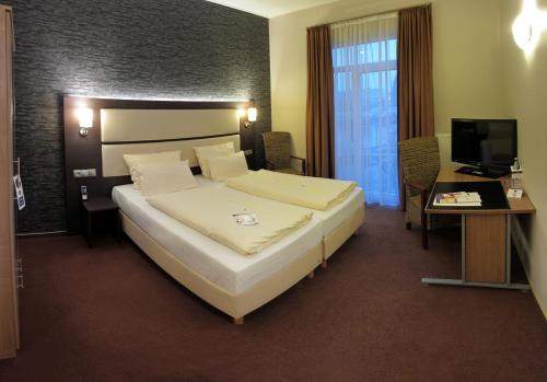 Imagen de la habitación del Hotel DORMERO Werther. Foto 9