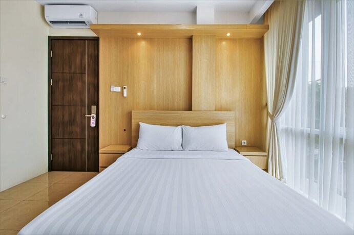 Imagen de la habitación del Hotel D'Padmaya Residence. Foto 2
