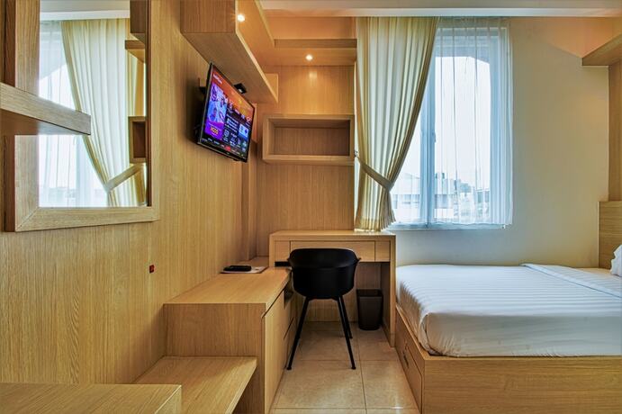 Imagen de la habitación del Hotel D'Padmaya Residence. Foto 5