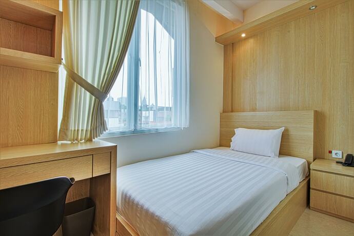 Imagen de la habitación del Hotel D'Padmaya Residence. Foto 10
