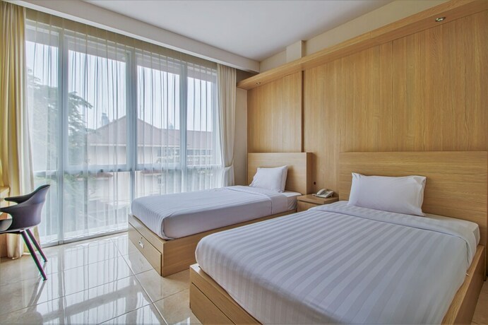Imagen de la habitación del Hotel D'Padmaya Residence. Foto 11
