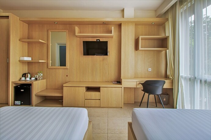Imagen de la habitación del Hotel D'Padmaya Residence. Foto 17