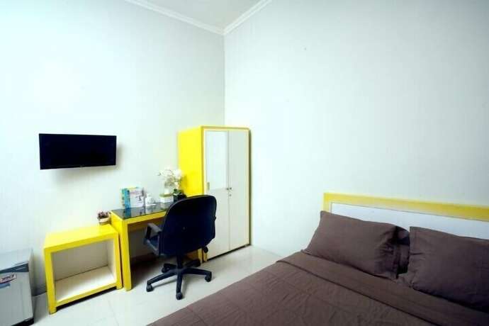 Imagen de la habitación del Hotel D'Paragon Tambakboyo. Foto 8