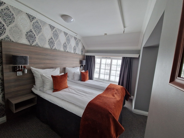 Imagen de la habitación del Hotel DR HOLMS. Foto 10