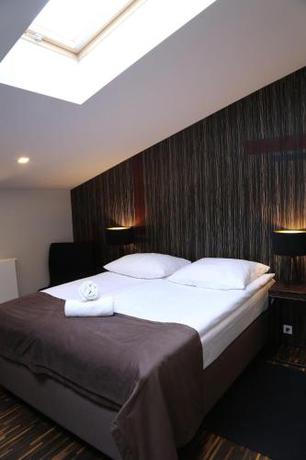 Imagen de la habitación del Hotel Dada Premium Aparthotel. Foto 20