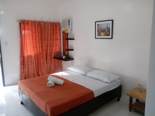 Imagen de la habitación del Hotel Dahilig Resort. Foto 18